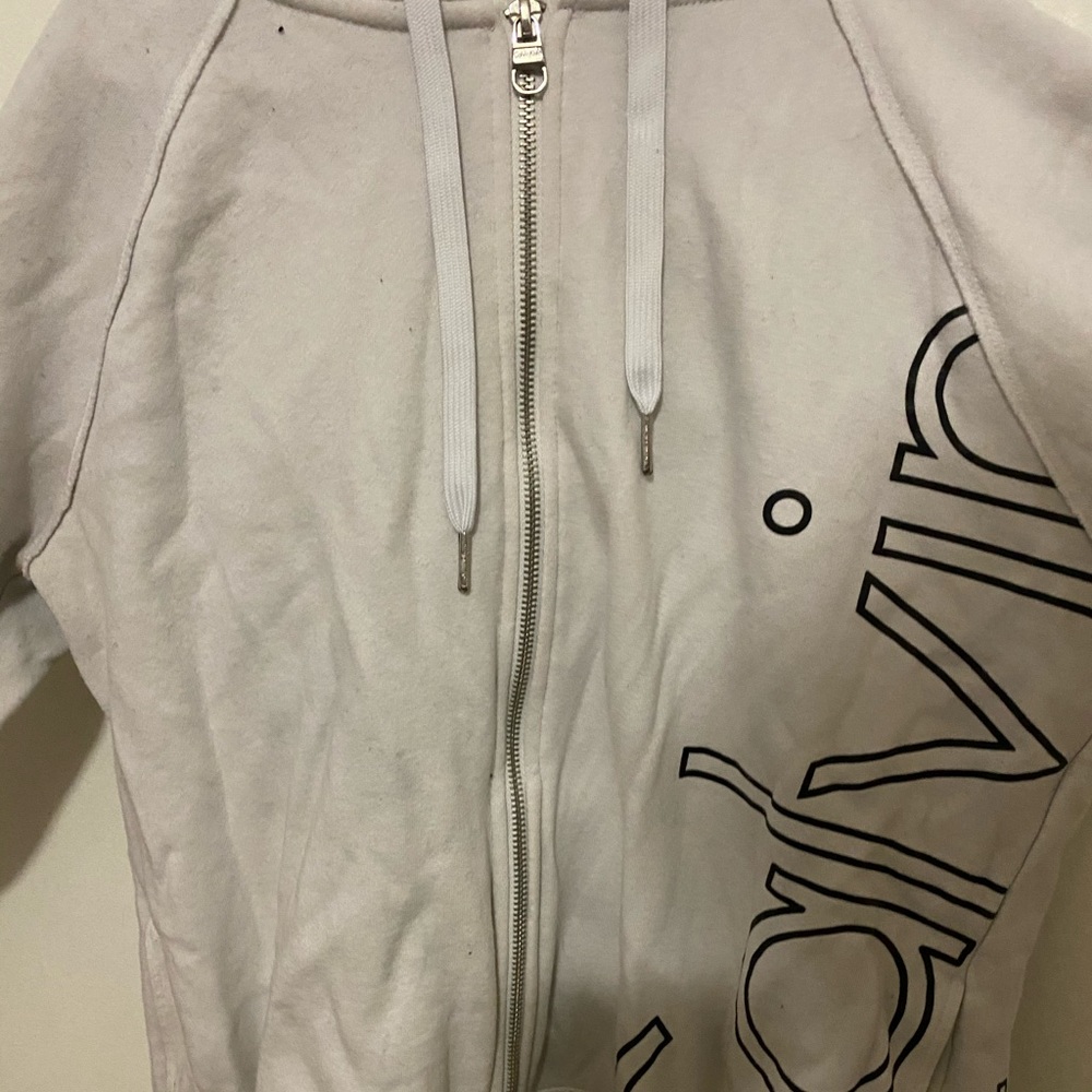 White CK zipup.